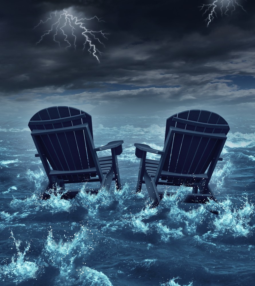 Two garden chairs weathering the storm at sea to represent family breakdowns are not smooth sailing.