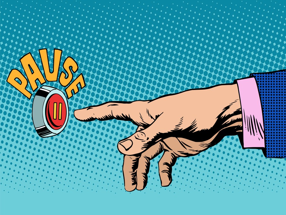 A pop art illustration of a hand pressing a pause button
