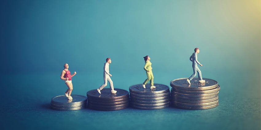 Small people standing in coins representing different people have varying financial situations.